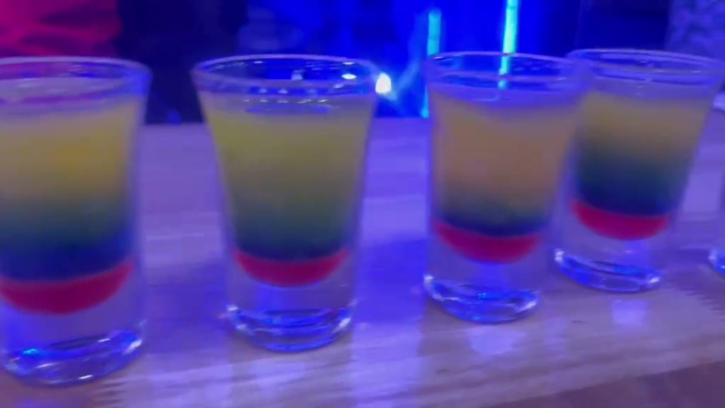 A row of layered shots on the bar at De Blue Lounge and Bar